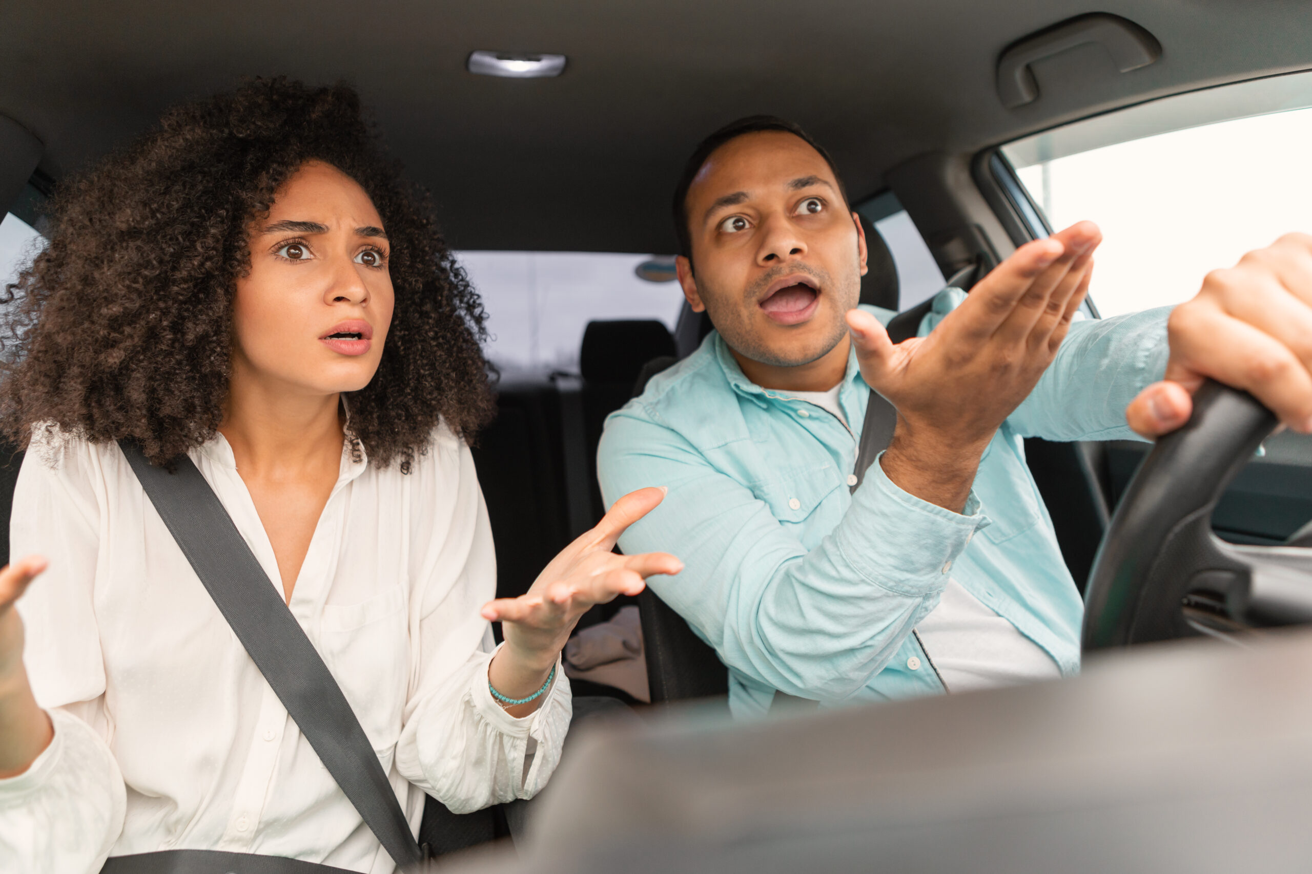 Discontented Couple Sitting In Car Having Danger Of Traffic Accident